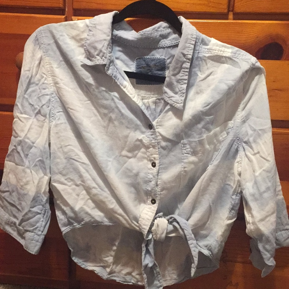 Blue and white button down collared shirt